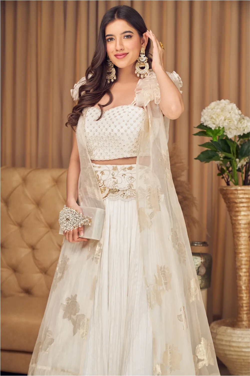 White Lehenga Choli And Sleeveless Cape With Ruffles